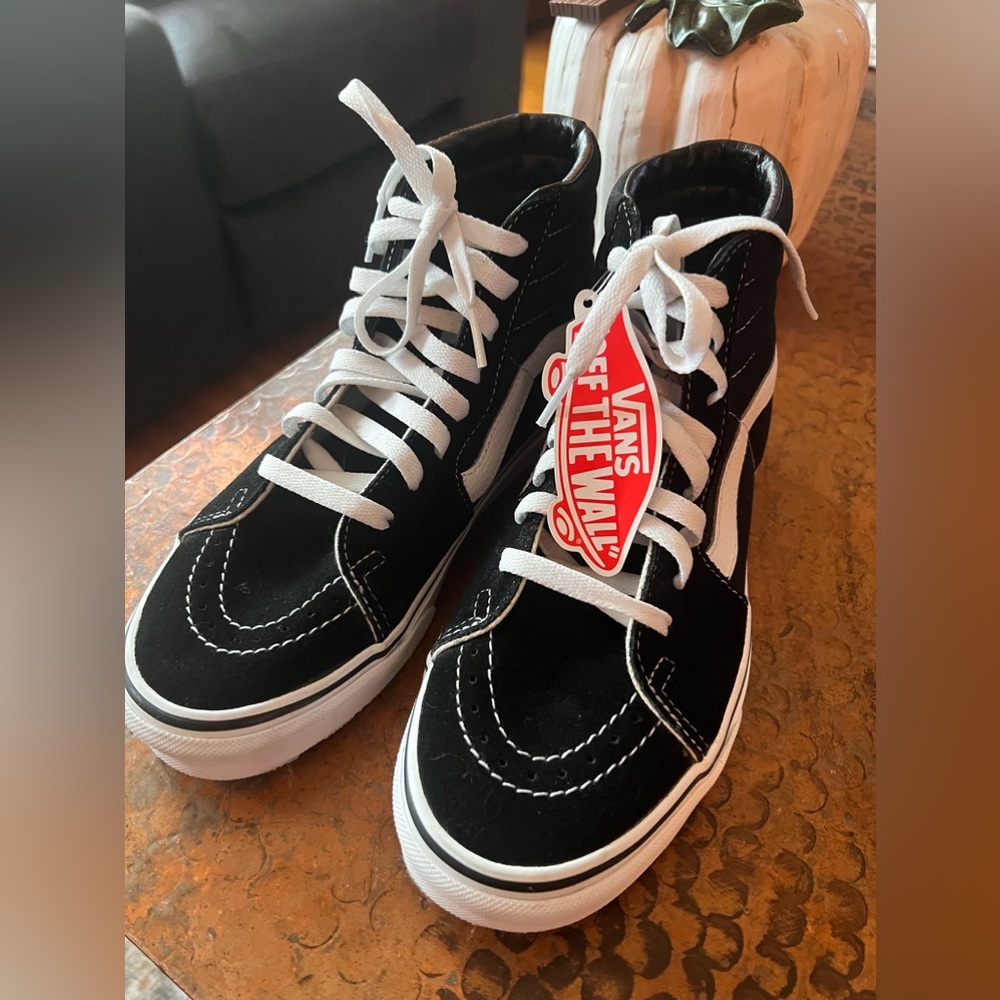 Gender neutral Vans in high top style!  Brand new with tag!  Size 8 in ladies.